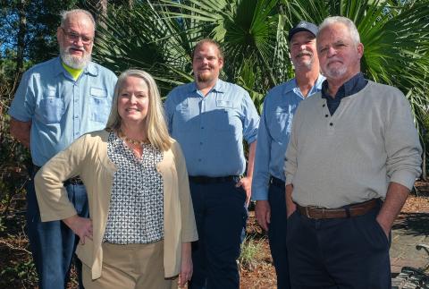 FROM LEFT: Conservation Specialist (WCS) Ed Bugbee, Water Conservation Manager Debra Burden, WCS Thomas McConnell, WCS Regonald West, and Florida-Friendly Landscaping Coordinator Steven Davis.